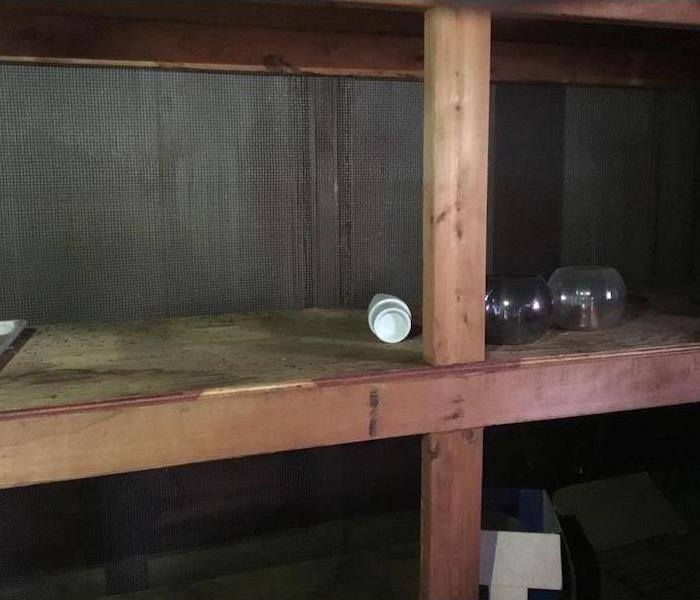 Wood cabin with shelves with small items on the shelves