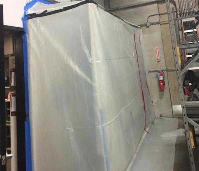 Poly sheeting containment barrier to isolate the work area