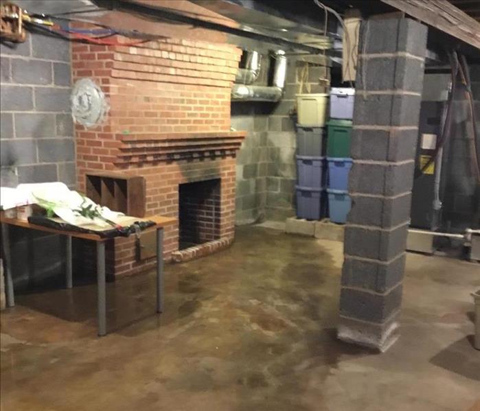 basement, wet floor, massive brick fireplace and cinder block support column